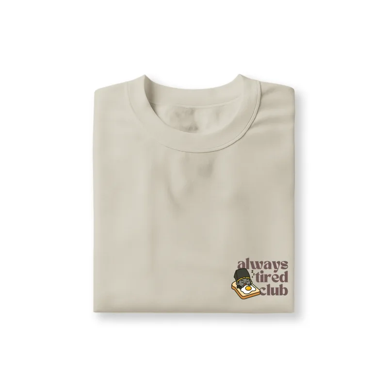 hei wu chang sleeping on toast with funny face and "always tired club" text printed on sand color t-shirt